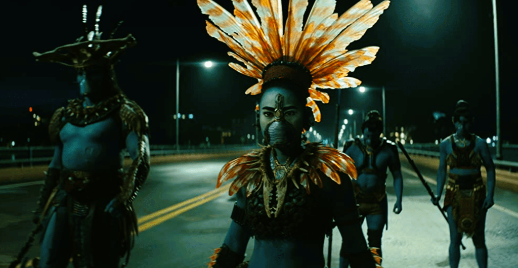 Blue people in decorative armor with spears standing on a bridge wearing oxygen masks.